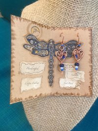 Deep Blue Lapis lazuli and Sky Blue Cat's Eye Glass playfully Dangle from the Handcrafted Beaded Copper Heart French Wire Earrings