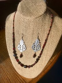 Dark and Alluring Garnet, Hematite, Faceted Glass and Bead Necklace with Pressed Metal Chandelier and Garnet Dangle Earring Set