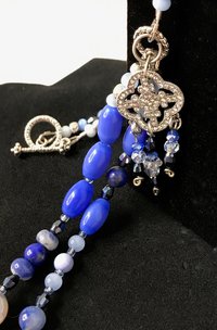 Summers Evening Shimmering Charm Necklace in Blue Shades of Crackle Agate, Sodalite, Lapis, Mother of Pearl, Cat's Eye, Faceted Glass Beads