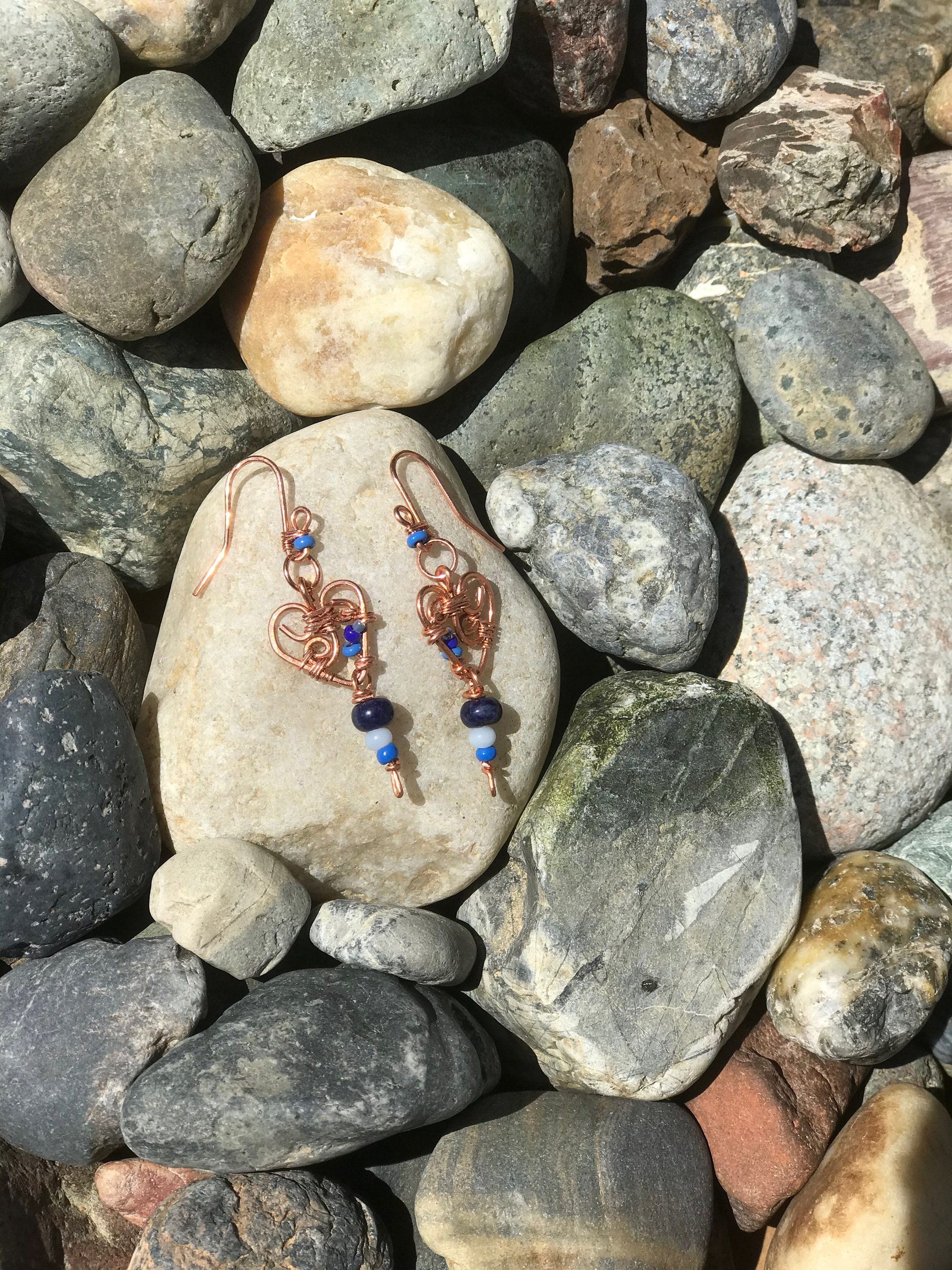 Deep Blue Lapis lazuli and Sky Blue Cat's Eye Glass playfully Dangle from the Handcrafted Beaded Copper Heart French Wire Earrings