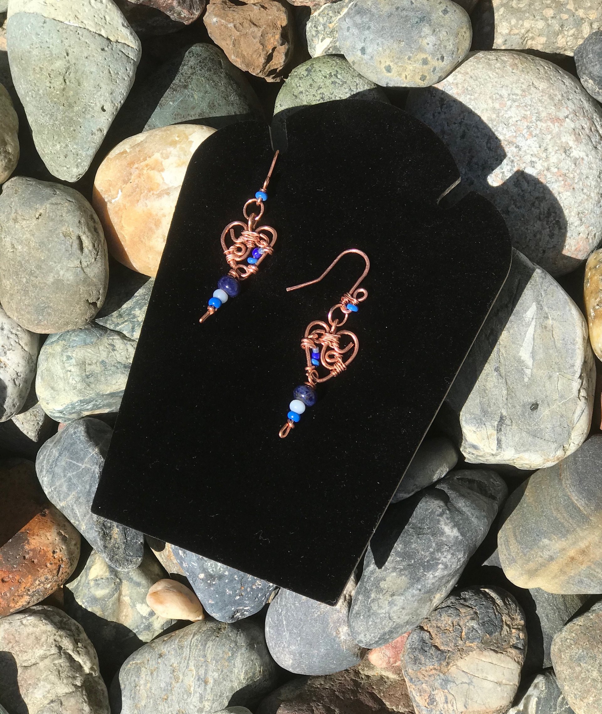 Deep Blue Lapis lazuli and Sky Blue Cat's Eye Glass playfully Dangle from the Handcrafted Beaded Copper Heart French Wire Earrings