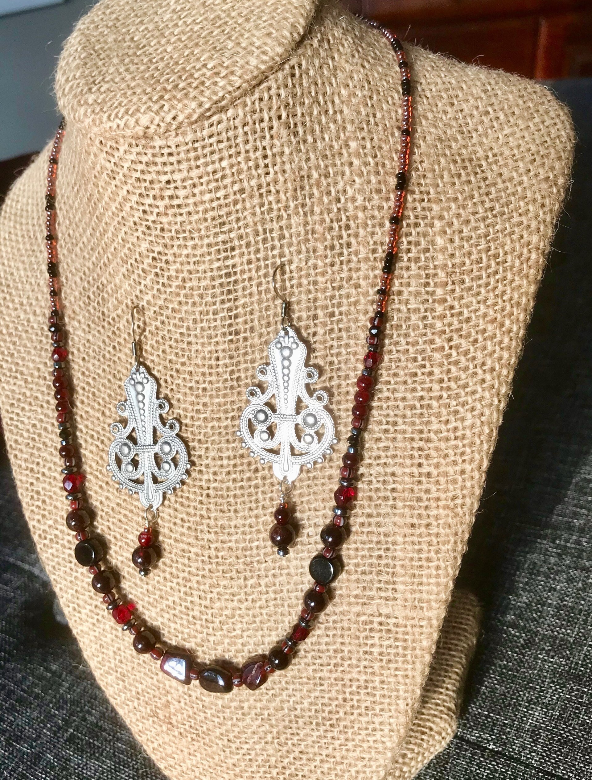 Dark and Alluring Garnet, Hematite, Faceted Glass and Bead Necklace with Pressed Metal Chandelier and Garnet Dangle Earring Set