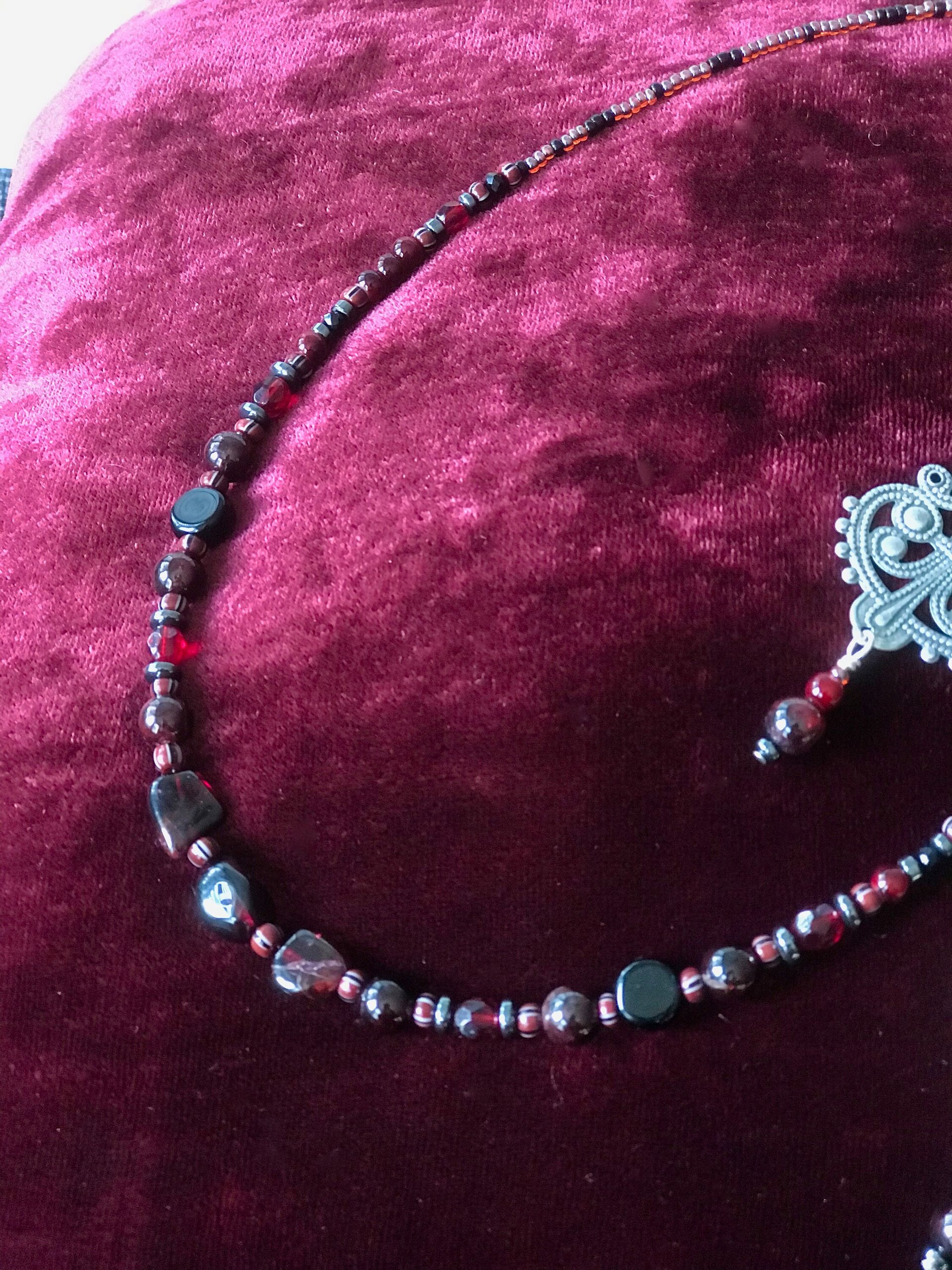 Dark and Alluring Garnet, Hematite, Faceted Glass and Bead Necklace with Pressed Metal Chandelier and Garnet Dangle Earring Set