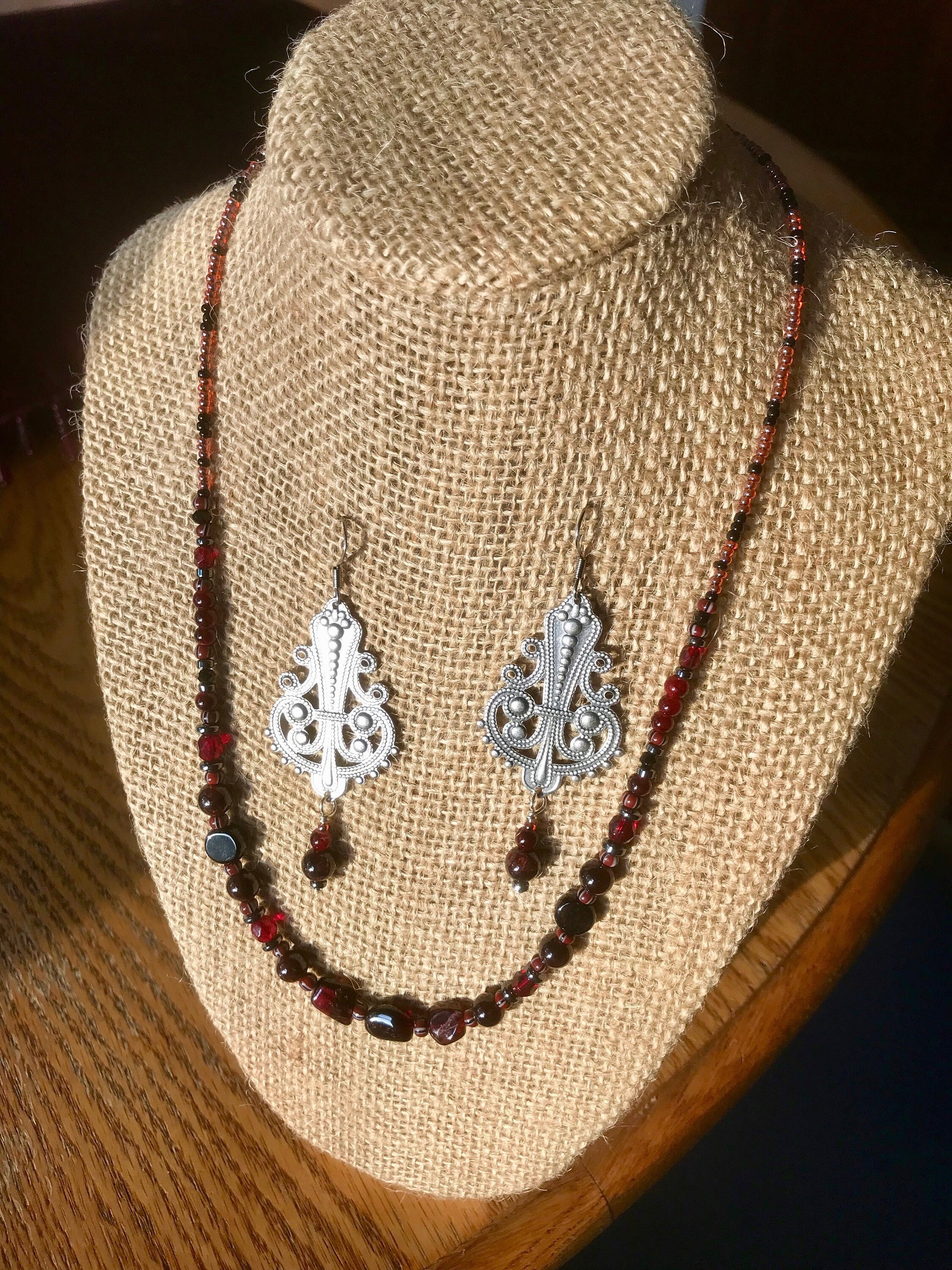 Dark and Alluring Garnet, Hematite, Faceted Glass and Bead Necklace with Pressed Metal Chandelier and Garnet Dangle Earring Set